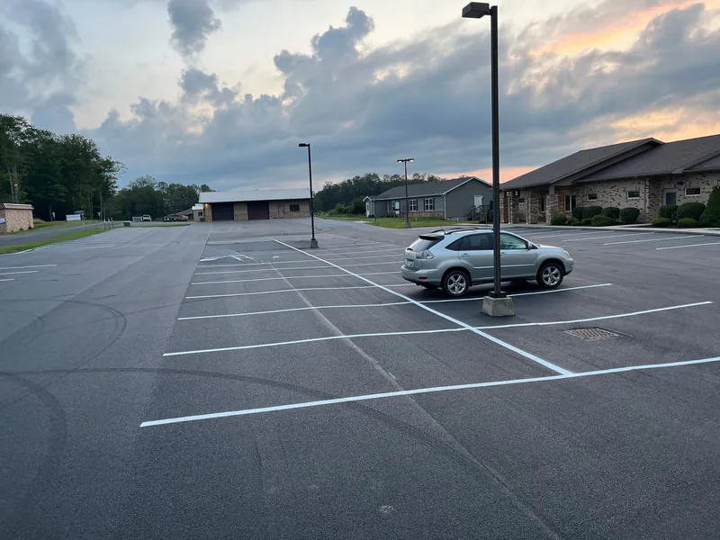 Finished parking lot with new striping at dusk